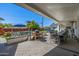 Inviting covered patio features a grilling area and spacious seating, ideal for relaxing outdoors at 4030 N 54Th Pl, Phoenix, AZ 85018