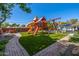 Outdoor playground with slide, swings, and climbing structure is set in the backyard at 4030 N 54Th Pl, Phoenix, AZ 85018
