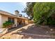 Landscaped backyard with covered patio, perfect for outdoor gatherings at 4102 W Fallen Leaf Ln, Glendale, AZ 85310
