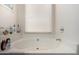 This bright bathroom features a large soaking tub perfect for relaxation, complemented with a corner window at 4102 W Fallen Leaf Ln, Glendale, AZ 85310