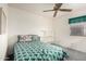 This bedroom features a corner window, light walls, and a comfortable bed at 4102 W Fallen Leaf Ln, Glendale, AZ 85310