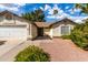 Inviting single-story home with a well-maintained yard, two-car garage, and desert landscaping at 4102 W Fallen Leaf Ln, Glendale, AZ 85310