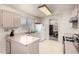 Bright kitchen with views into the dining area, offering a functional and inviting space at 4102 W Fallen Leaf Ln, Glendale, AZ 85310