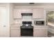 Functional kitchen with ample cabinet space, modern appliances, and convenient layout at 4102 W Fallen Leaf Ln, Glendale, AZ 85310
