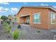 Charming backyard featuring a well-maintained patio and attractive desert landscaping at 42335 W Waterfall Way, Maricopa, AZ 85138