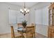 Bright dining area with a chandelier and a hutch at 42335 W Waterfall Way, Maricopa, AZ 85138