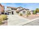 Beautiful two-story home featuring a three-car garage and desert landscaping for low maintenance at 44314 W Mescal St, Maricopa, AZ 85138