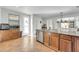 Bright kitchen with wood cabinets, stainless steel appliances and a large island at 44314 W Mescal St, Maricopa, AZ 85138