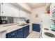 Bright kitchen with white cabinets, stainless steel appliances, and an eat-in bar at 4554 E Paradise Village N Pkwy # 210, Phoenix, AZ 85032