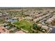 Aerial view of the neighborhood showing the community park with splash pad, playground and pond at 5012 S Girard St, Gilbert, AZ 85298