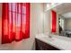 Bathroom featuring modern vanity with quartz countertop, framed mirror and sleek faucet at 5012 S Girard St, Gilbert, AZ 85298