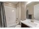 Bathroom with shower and tub combination, white vanity with sink, and a neutral color scheme at 5012 S Girard St, Gilbert, AZ 85298