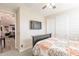 Bedroom featuring a television and doorway leading into a living area at 5012 S Girard St, Gilbert, AZ 85298