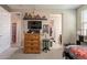 View of a bedroom with warm wood dresser, ceiling fan and decor at 5012 S Girard St, Gilbert, AZ 85298