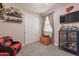 room with display shelves of toys and a TV, creating an engaging space at 5012 S Girard St, Gilbert, AZ 85298