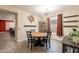 Cozy dining area featuring a round table, modern chandelier, and natural light at 5012 S Girard St, Gilbert, AZ 85298