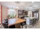 Spacious kitchen with granite counters, dark cabinets, and stainless steel appliances adjoins a dining area at 5012 S Girard St, Gilbert, AZ 85298