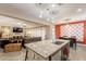 Open kitchen featuring granite countertops, dark wood cabinets, and seamless living room views at 5012 S Girard St, Gilbert, AZ 85298