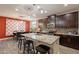Bright kitchen featuring granite countertops, stainless steel appliances, and dark wood cabinets at 5012 S Girard St, Gilbert, AZ 85298