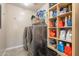 Modern laundry room featuring a washer and dryer with ample storage shelves at 5012 S Girard St, Gilbert, AZ 85298