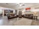 Comfortable living room features seamless flow to kitchen, wood floors, and ample seating at 5012 S Girard St, Gilbert, AZ 85298