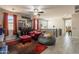 Cozy sitting area with red leather chair, ottoman, beanbag, and decoratively-shelved memorabilia at 5012 S Girard St, Gilbert, AZ 85298