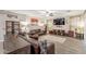 Spacious living room with wood-look tile flooring and comfortable seating at 5012 S Girard St, Gilbert, AZ 85298