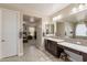 Luxury ensuite bathroom features and sinks, extensive counter space, and walk-in closet access at 5012 S Girard St, Gilbert, AZ 85298
