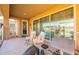 Covered patio featuring outdoor seating, a workout area, and view to the backyard at 5012 S Girard St, Gilbert, AZ 85298