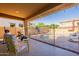 Covered patio featuring outdoor seating and a view of the backyard pool area at 5012 S Girard St, Gilbert, AZ 85298