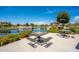 A serene pond with chess tables and picnic benches with lush landscaping at 5012 S Girard St, Gilbert, AZ 85298