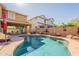 Backyard pool with lounge area and view of neighboring houses at 5012 S Girard St, Gilbert, AZ 85298
