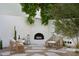 Cozy backyard space featuring comfortable seating and an outdoor fireplace at 5101 N Casa Blanca Dr # 223, Paradise Valley, AZ 85253