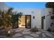 Backyard view featuring a neutral color scheme, desert landscaping, and an open patio at 5101 N Casa Blanca Dr # 223, Paradise Valley, AZ 85253