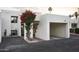 Southwest-style home with crisp white walls, a bougainvillea, and convenient carport parking at 5101 N Casa Blanca Dr # 223, Paradise Valley, AZ 85253