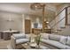 Open-concept living room with a dining area, kitchen, and staircase at 5101 N Casa Blanca Dr # 223, Paradise Valley, AZ 85253