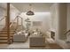 Bright living room featuring stylish furniture, a fireplace, and an open staircase at 5101 N Casa Blanca Dr # 223, Paradise Valley, AZ 85253