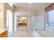 Bathroom with shower and tub, vanity, and tiled floor and mirrors at 5185 W Del Rio St, Chandler, AZ 85226