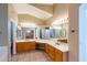 Spacious bathroom with dual sinks, tile floor, vanity, and large mirror at 5185 W Del Rio St, Chandler, AZ 85226