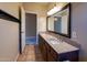 Spacious bathroom features double sinks with granite countertops and updated fixtures at 5185 W Del Rio St, Chandler, AZ 85226