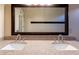 Bright bathroom featuring double sinks with granite countertops and modern faucet fixtures at 5185 W Del Rio St, Chandler, AZ 85226