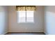 Cozy bedroom with a window and neutral walls and flooring at 5185 W Del Rio St, Chandler, AZ 85226