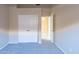 Bedroom with double closet doors leading to another room with an open doorway at 5185 W Del Rio St, Chandler, AZ 85226