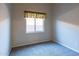 Bedroom with neutral walls, carpet, and a window dressed with a simple valance at 5185 W Del Rio St, Chandler, AZ 85226