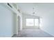 Bright bedroom with tall ceilings, fan, and an arched doorway leading to another room at 5185 W Del Rio St, Chandler, AZ 85226