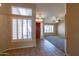 Inviting foyer with tile flooring, decorative window, and natural light at 5185 W Del Rio St, Chandler, AZ 85226