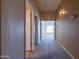 Hallway with carpet flooring, and doorway views to other rooms at 5185 W Del Rio St, Chandler, AZ 85226