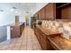 Spacious kitchen with granite countertops, stainless steel appliances, and large center island at 5185 W Del Rio St, Chandler, AZ 85226