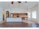 Open-concept kitchen featuring granite countertops, stainless steel appliances, and modern lighting at 5185 W Del Rio St, Chandler, AZ 85226