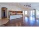 Bright and spacious living area with a kitchen, dining area, and sliding door access at 5185 W Del Rio St, Chandler, AZ 85226